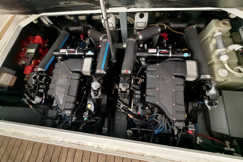 Slide: The Image of Engine compartment of a 2001 Sea Ray 340 Sundancer boat, showcasing dual engines. - 29