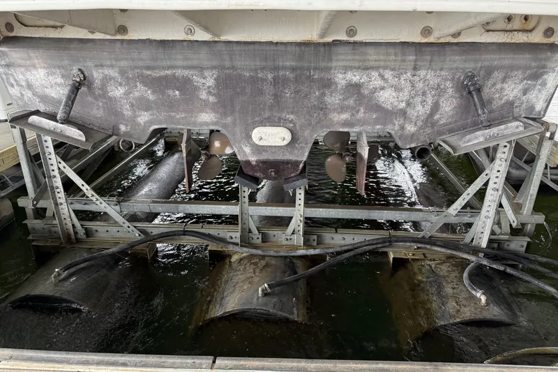 Slide: The Image of Rear view of a 2001 Sea Ray 340 Sundancer on a boat lift. - 3