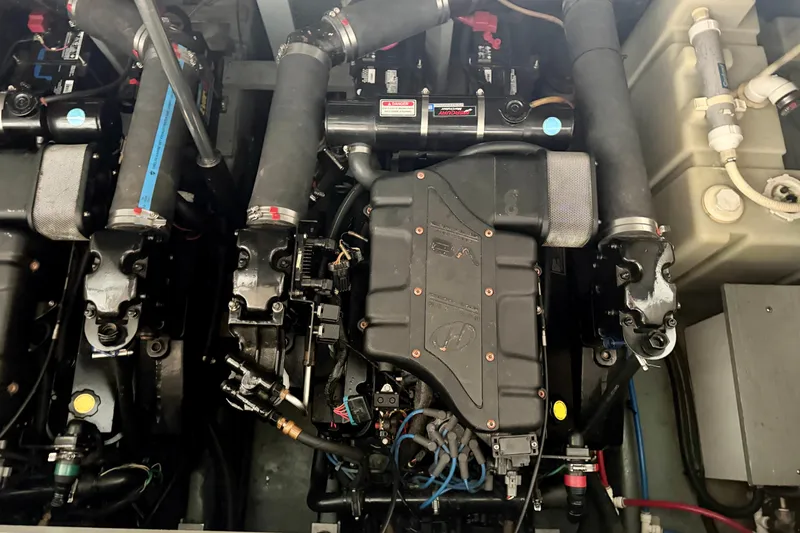 Slide: The Image of Engine compartment of a 2001 Sea Ray 340 Sundancer boat, showcasing mechanical components. - 30