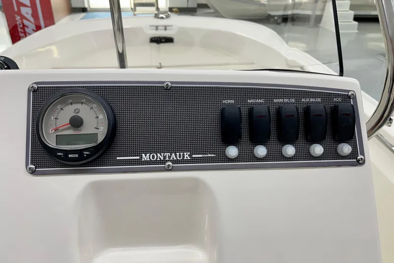 Slide: The Image of Dashboard of 2026 Boston Whaler 170 Montauk with switches and tachometer. - 5