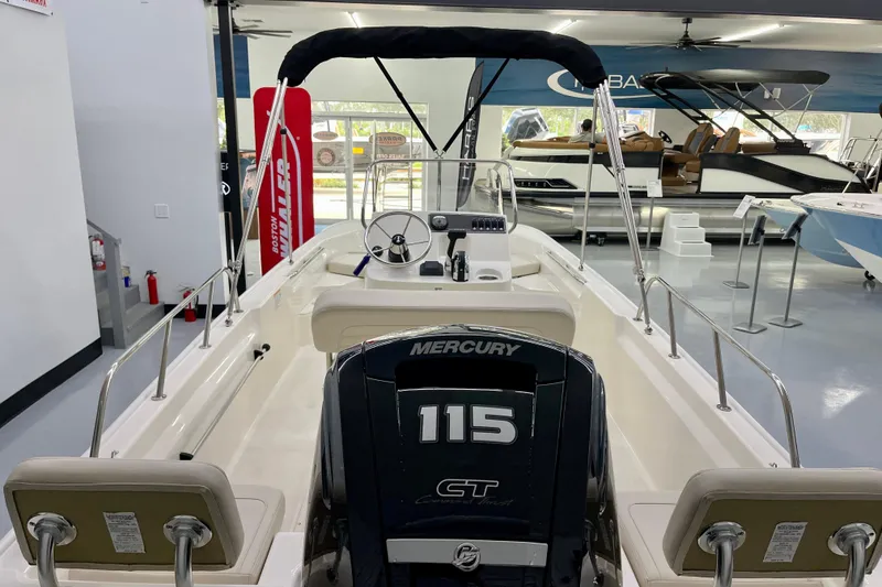 Slide: The Image of Boston Whaler 170 Montauk 2026 with Mercury 115 engine in showroom. - 6