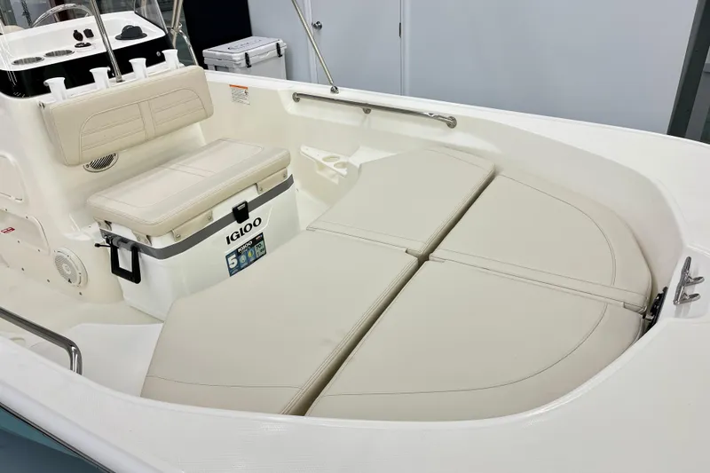 Slide: The Image of Interior of 2026 Boston Whaler 170 Montauk with seating cushions and cooler. - 7