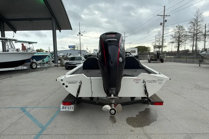 Slide: The Image of 2022 Tracker Pro Team 190 TX Tournament Edition boat with Mercury engine, parked outdoors. - 5