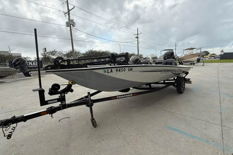 Slide: The Image of 2022 Tracker Pro Team 190 TX Tournament Edition boat on trailer in parking lot. - 8