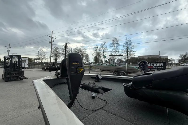 Slide: The Image of 2022 Tracker Pro Team 190 TX Tournament Edition boat with Maxxum motor, parked outdoors. - 9