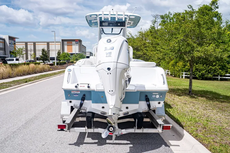 Slide: The Image of Rear view of a 2026 Sea Hunt Ultra 245 SE boat on a trailer. - 3