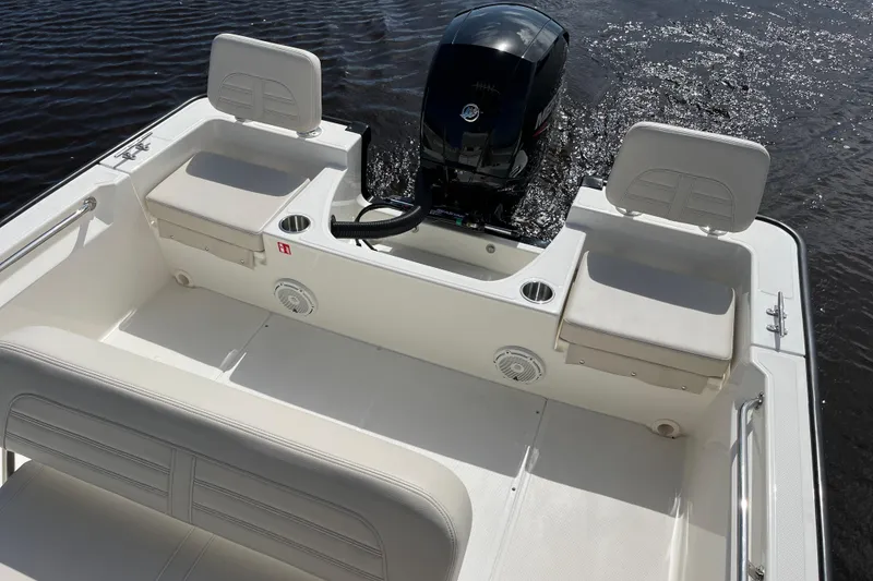Slide: The Image of Boston Whaler 190 Montauk 2026 with motor on calm water. - 18