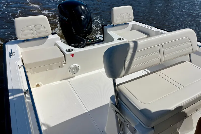 Slide: The Image of Interior of 2026 Boston Whaler 190 Montauk with seating and motor. - 19