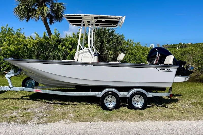 Slide: The Image of 2026 Boston Whaler 190 Montauk on trailer, parked outdoors. - 4