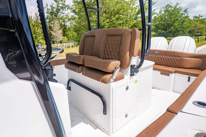 Slide: The Image of Interior of Sea Hunt ULTRA 285CB 2026 with brown leather seats. - 18