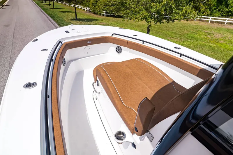 Slide: The Image of 2026 Sea Hunt ULTRA 285CB boat with brown upholstery. - 20