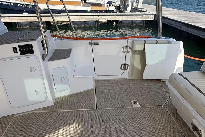 Slide: The Image of 2026 Ranger Tugs R-43 CB boat deck with seating and dock view. - 13