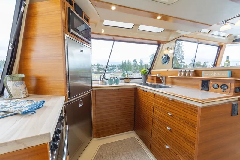 Slide: The Image of Luxurious kitchen interior of 2025 Ranger Tugs 43 Command Bridge yacht. - 28