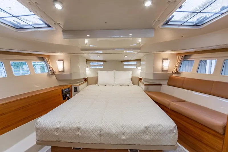 Slide: The Image of Luxurious interior of 2025 Ranger Tugs 43 Command Bridge with spacious bed and elegant design. - 32