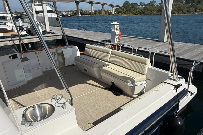 Slide: The Image of 2026 Ranger Tugs R-43 CB boat deck with seating and sink at marina. - 7