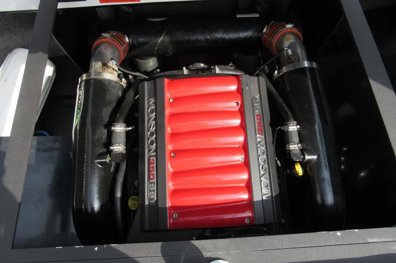 Slide: The Image of 2013 Malibu Wakesetter 20 VTX Monsoon 350 engine with red cover and black components. - 12