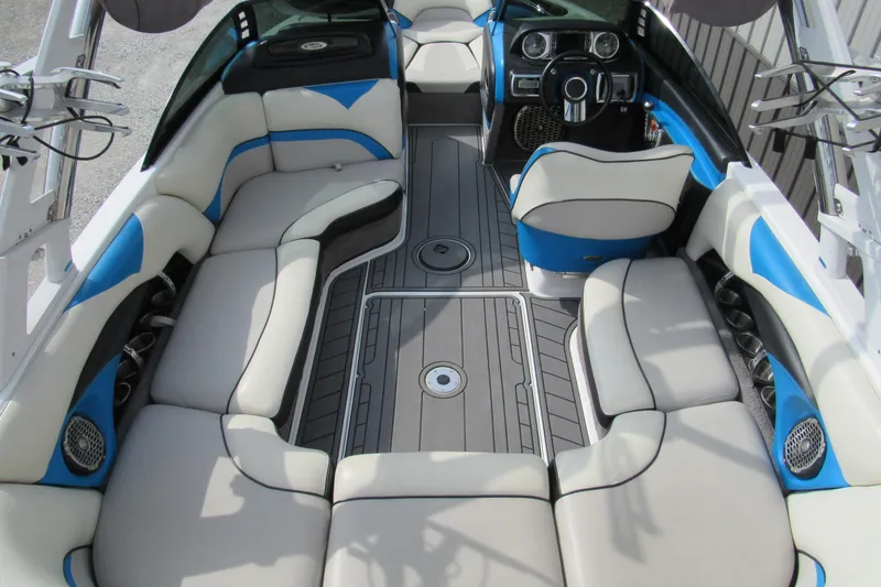 Slide: The Image of 2013 Malibu Wakesetter 20 VTX interior with blue and white seating, sleek design. - 3
