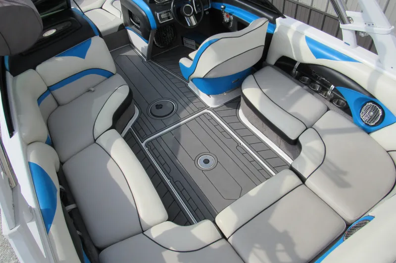 Slide: The Image of 2013 Malibu Wakesetter 20 VTX interior with gray and blue seating, modern design. - 6