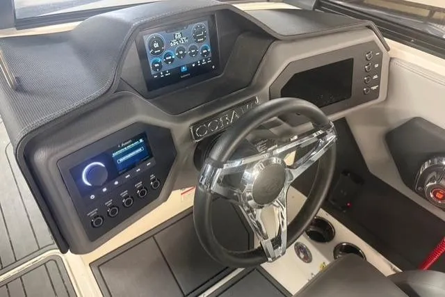 Slide: The Image of 2025 Cobalt CS22 boat dashboard with modern controls and digital display. - 12