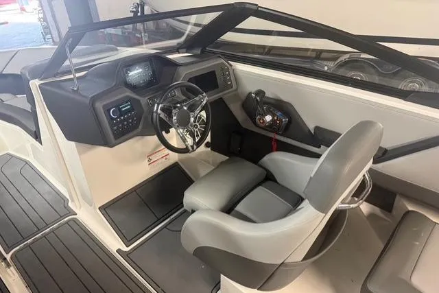 Slide: The Image of 2025 Cobalt CS22 boat interior with modern dashboard and comfortable seating. - 14