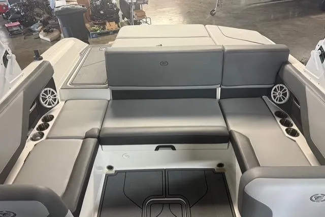 Slide: The Image of 2025 Cobalt CS22 boat interior with gray seating and cup holders. - 15
