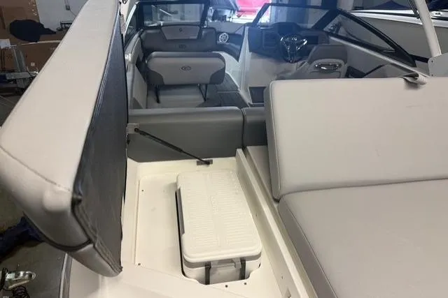 Slide: The Image of 2025 Cobalt CS22 boat interior with seating and storage compartment. - 19