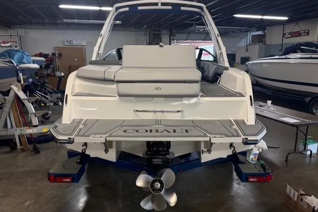 Slide: The Image of 2025 Cobalt CS22 boat in a showroom, rear view showcasing deck and propeller. - 21