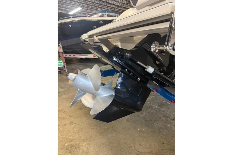 Slide: The Image of 2025 Cobalt CS22 boat propeller and stern drive in a showroom setting. - 22