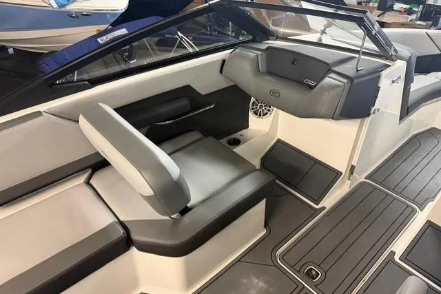 Slide: The Image of 2025 Cobalt CS22 boat interior with sleek seating and modern dashboard design. - 7