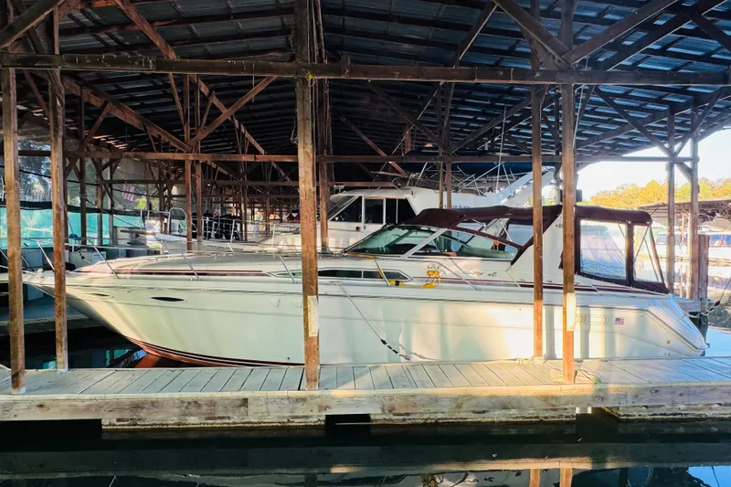 Slide: The Image of 1991 Sea Ray Sundancer 350 docked in a covered marina. - 15