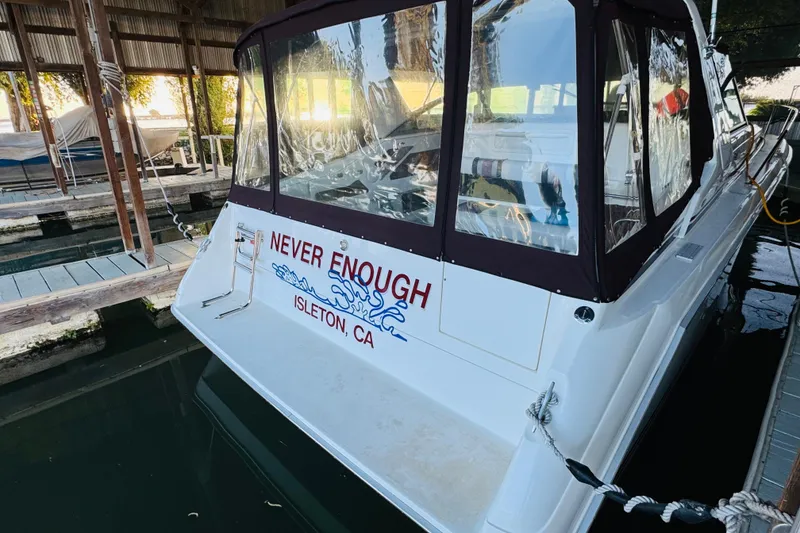 Slide: The Image of 1991 Sea Ray Sundancer 350 docked, featuring "Never Enough" name, Isleton, CA. - 17