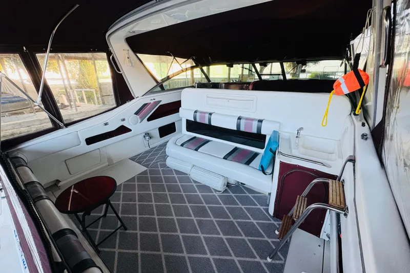 Slide: The Image of Interior of a 1991 Sea Ray Sundancer 350 boat with seating and nautical decor. - 18