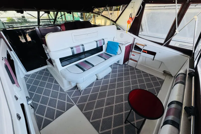 Slide: The Image of Interior of a 1991 Sea Ray Sundancer 350 boat with stylish seating and carpet. - 19