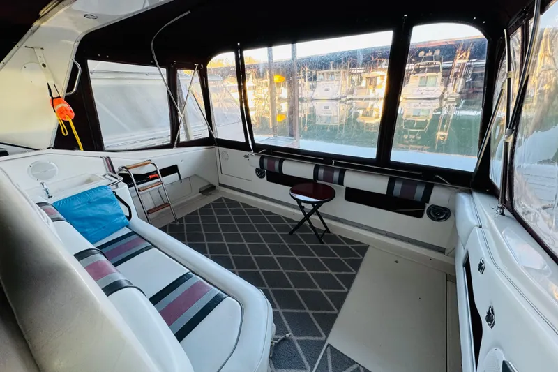 Slide: The Image of Interior of a 1991 Sea Ray Sundancer 350 boat with seating and windows. - 20