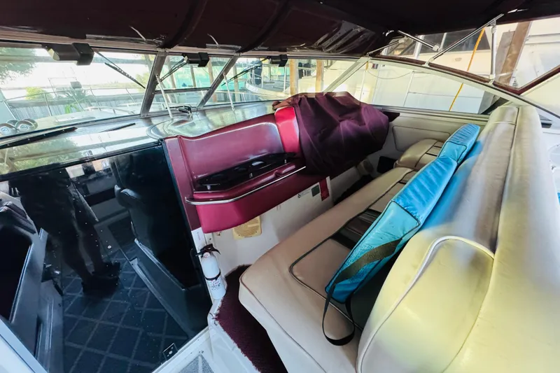 Slide: The Image of Interior of a 1991 Sea Ray Sundancer 350 boat with seating and dashboard. - 21