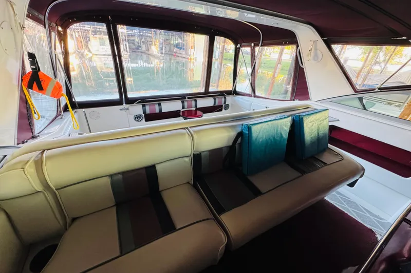 Slide: The Image of Interior of a 1991 Sea Ray Sundancer 350 boat with cushioned seating. - 25