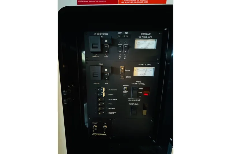 Slide: The Image of Electrical control panel on a 1991 Sea Ray Sundancer 350 boat. - 42