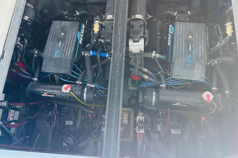 Slide: The Image of Engine compartment of a 1991 Sea Ray Sundancer 350 boat with MerCruiser engines. - 43