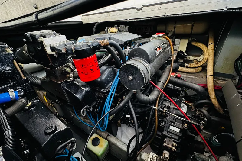 Slide: The Image of Engine compartment of a 1991 Sea Ray Sundancer 350 boat, showcasing mechanical components. - 44