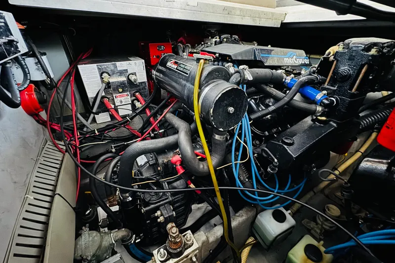Slide: The Image of Engine compartment of a 1991 Sea Ray Sundancer 350 with visible wiring and components. - 45