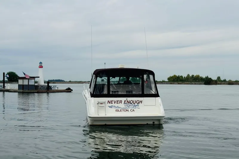 Slide: The Image of 1991 Sea Ray Sundancer 350 boat on water near a lighthouse, Isleton, CA. - 6