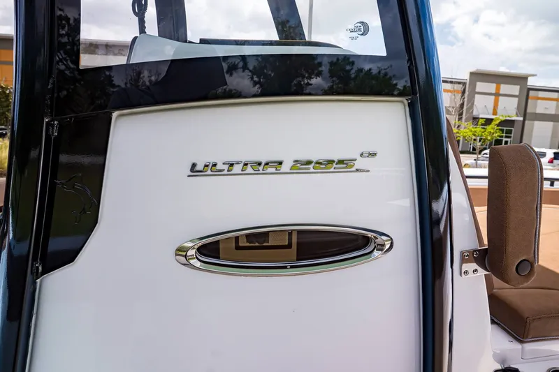 Slide: The Image of Sea Hunt ULTRA 285CB 2026 boat rear with logo. - 17