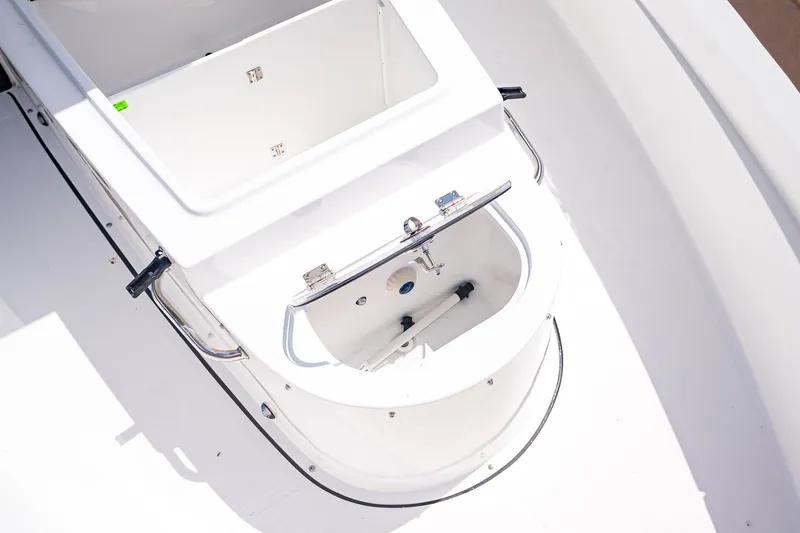 Slide: The Image of Sea Hunt ULTRA 285CB 2026, deck and storage compartment detail. - 24