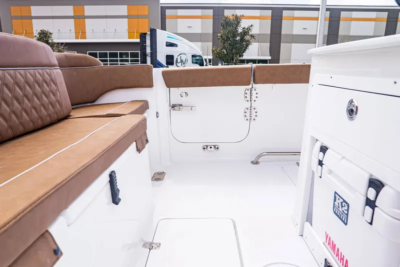 Slide: The Image of Interior of 2026 Sea Hunt ULTRA 285CB with brown upholstery. - 7