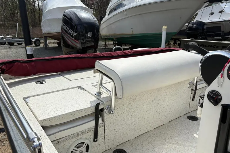 Slide: The Image of 2016 Ranger RB190 boat interior with Mercury outboard motor in a marina setting. - 7