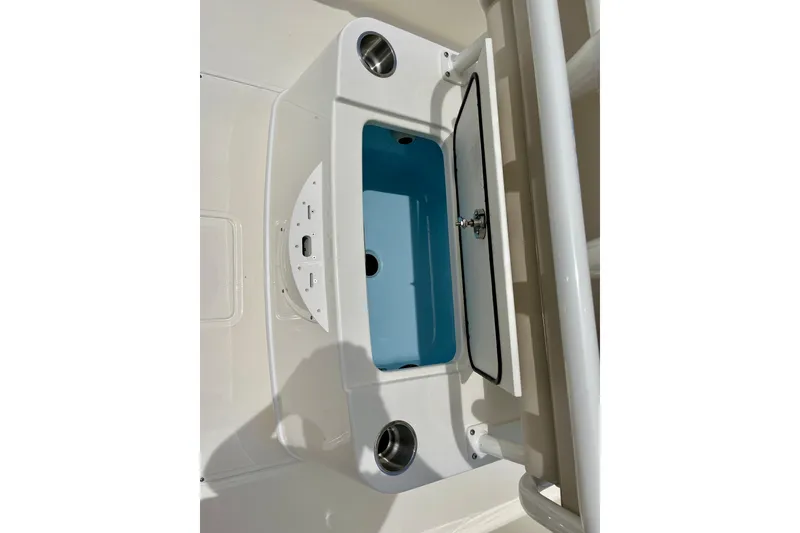 Slide: The Image of Boston Whaler 220 Dauntless 2026, blue storage compartment on boat. - 11