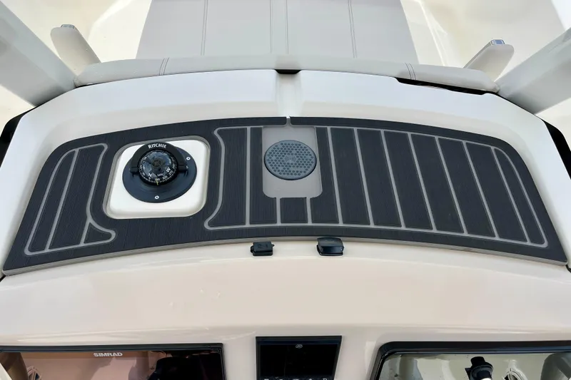 Slide: The Image of Boston Whaler 220 Dauntless 2026 with compass and speaker. - 15