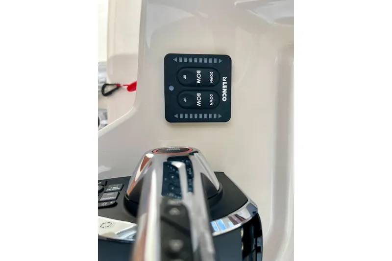 Slide: The Image of Boston Whaler 220 Dauntless 2026 console with Lenco control panel. - 16