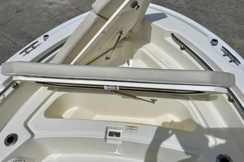 Slide: The Image of Boston Whaler 220 Dauntless 2026, seating area and storage. - 22