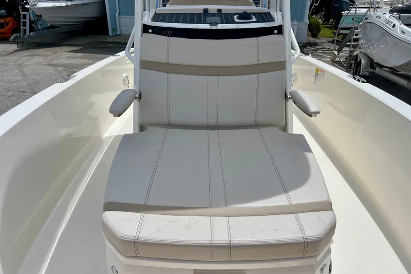 Slide: The Image of Boston Whaler 220 Dauntless 2026, seating area on a boat. - 24